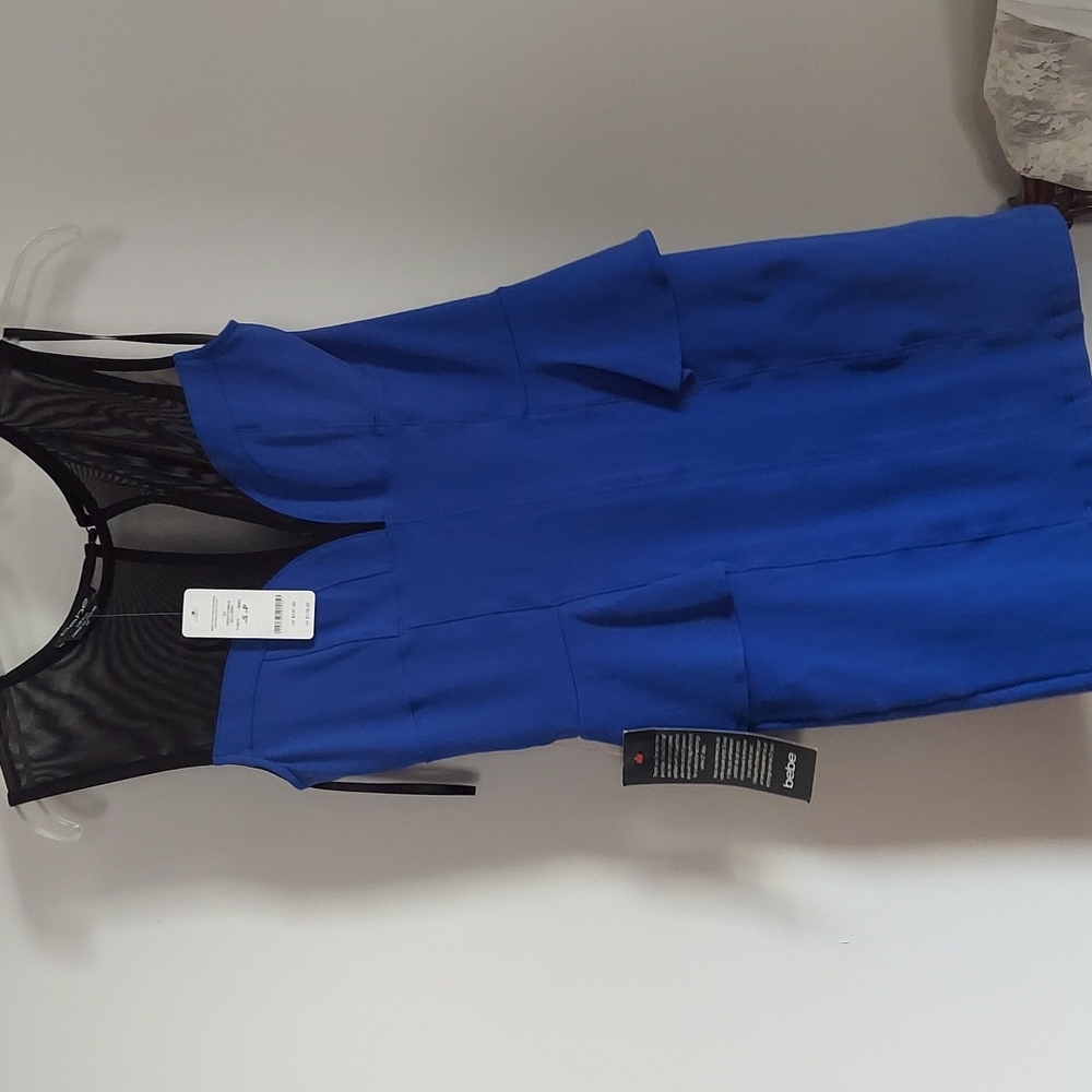 BEBE blue and black peplum dress with mesh yoke small